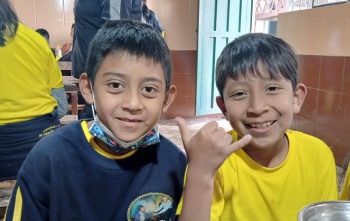 Boys eating Mary's Meals in Ecuador