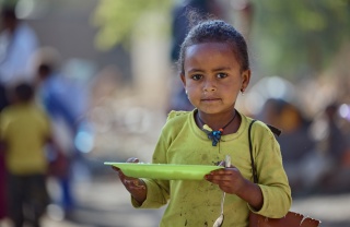 Girl eating Mary's Meals in Ethiopia