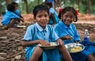 Children eating Mary's Meals in India