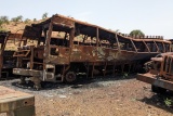 Image of buses left rusting and ruined.
