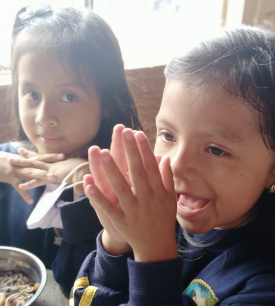Girls eating Mary's Meals in Ecuador